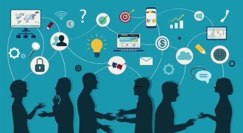 Employees in a meeting discussing compliance communications strategies to improve employee engagement.